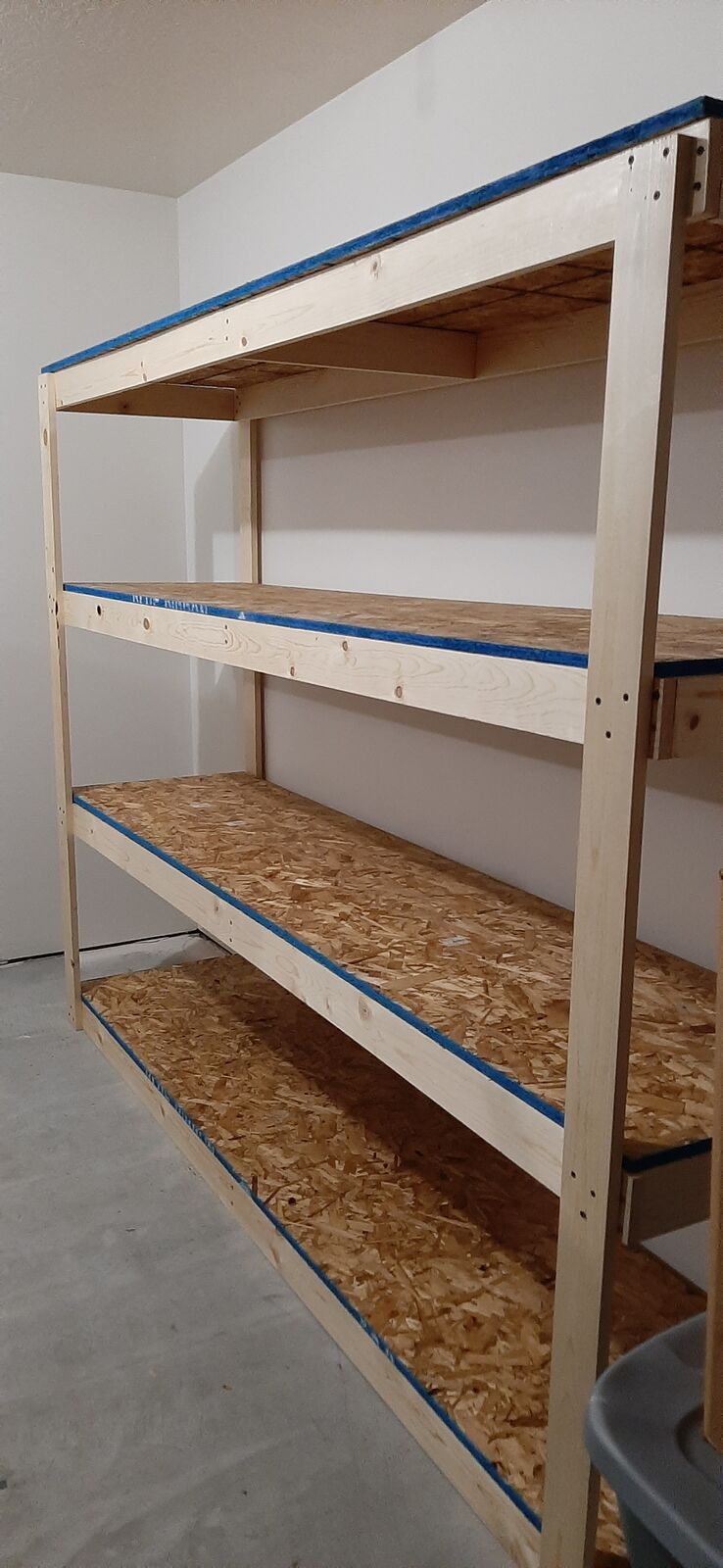 Solid wood shelving for the garage storage area measures 73 1/2 " Width x 58" Tall