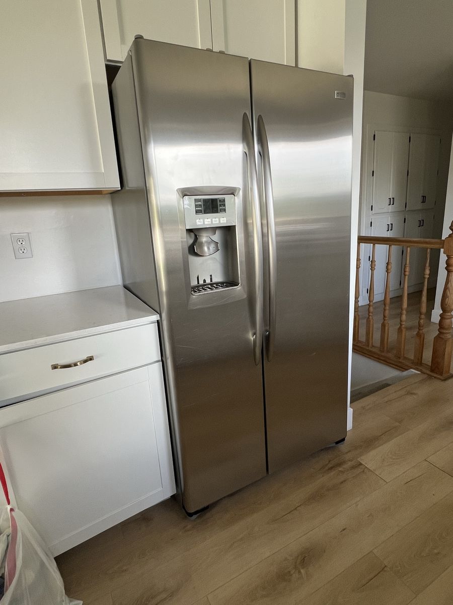 GE Profile Counter Depth Stainless Steel Side-by-Side Refrigerator with Ice & Water Dispenser