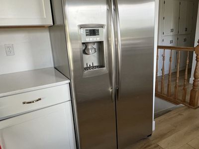 GE Profile Counter Depth Stainless Steel Side-by-Side Refrigerator with Ice & Water Dispenser