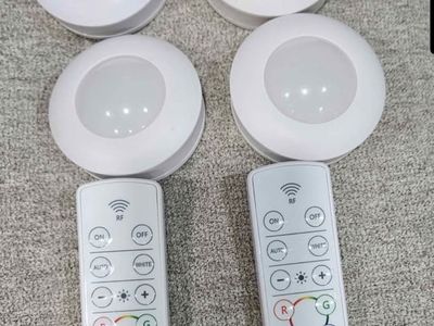 Energizer wireless color changing light pucks. 2 sets of 2 or 4 lights& remote