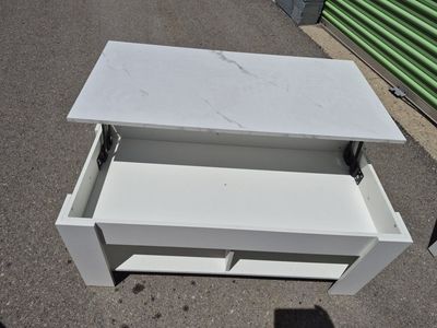 white lift-top coffee table with lower storage shelving