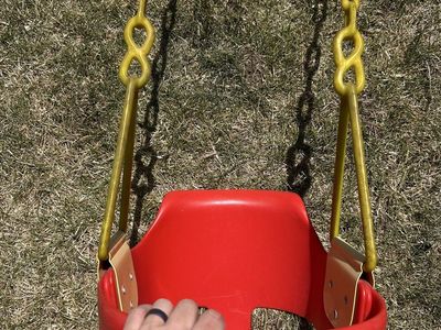 Child’s bucket swing with back rest