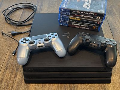Used Sony PlayStation 4 (PS4) Pro 1TB Console Bundle - 2 Controllers & 6 Games
