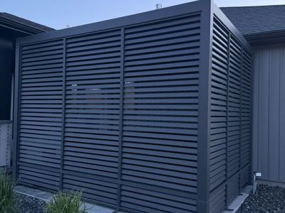 NEW MIRADOR ALUMINUM 10’X13’ CHARCOAL PERGOLA WITH TWO ALUMINUM PRIVACY WALLS.