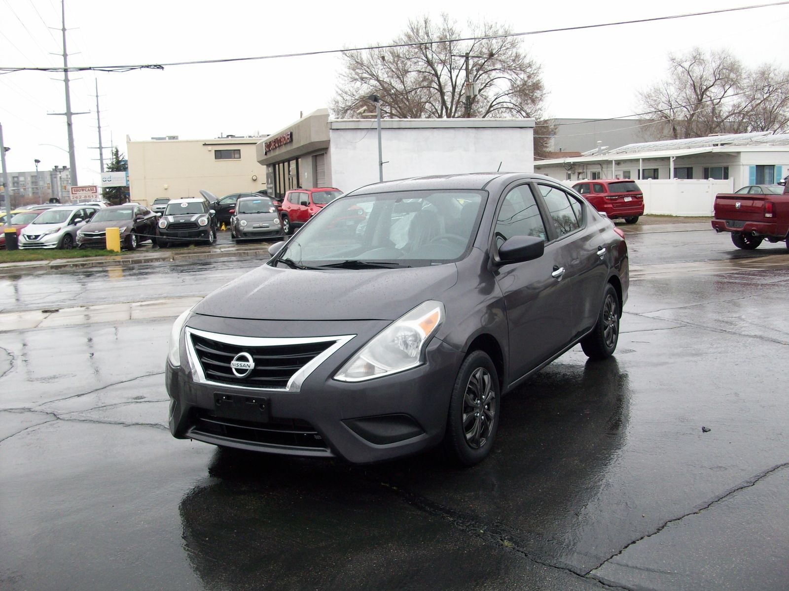 2015 Nissan Versa 1.6 SV — rebuilt & branded title, 30% below market