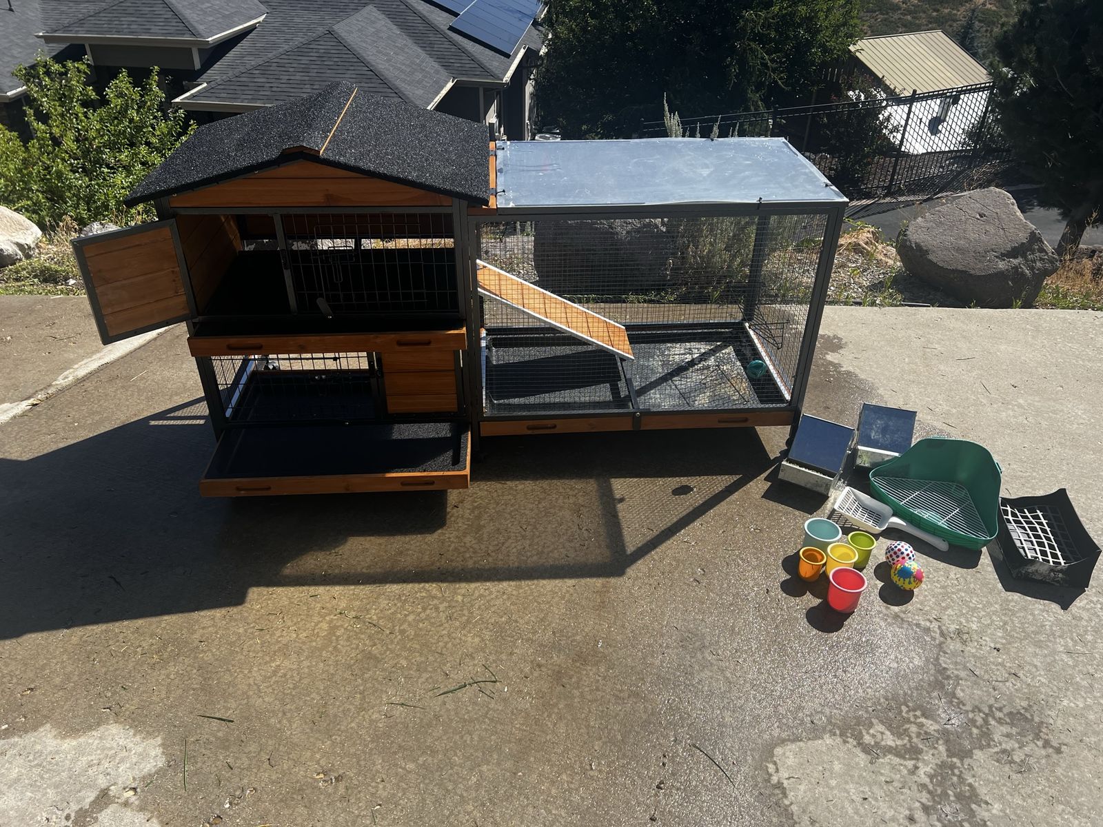 Two female bunnies with two story tier level wooden hutch with slide out shelves, food, bedding, and accessories. Loves kids!