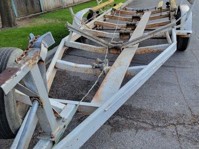 Used Boat Trailer with Rollers and Bunks, could easily be converted to flat bed trailer.