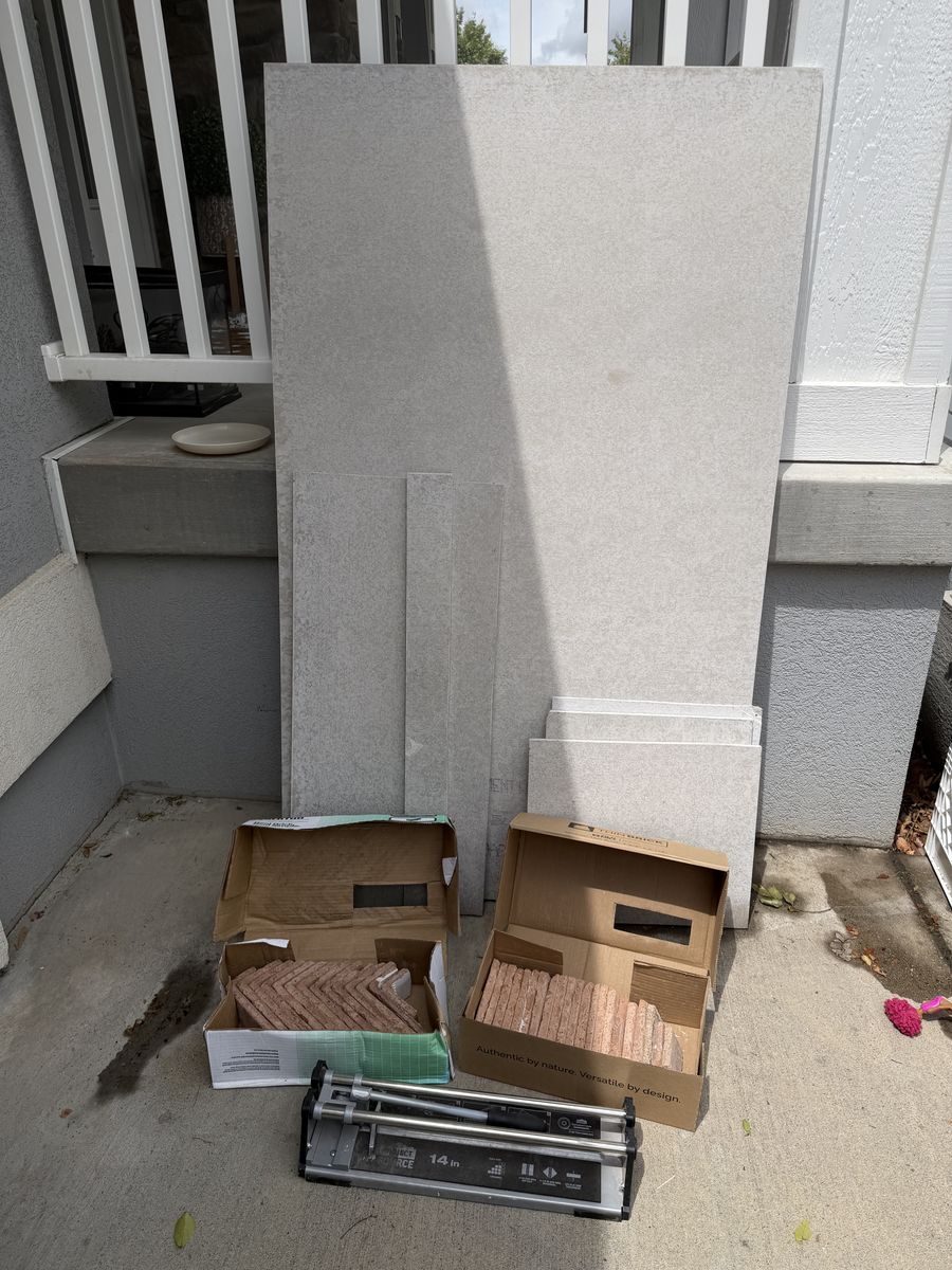 Brick backer board scraps, thin brick tiles and cutter