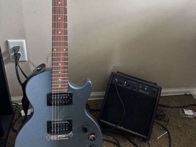 Epiphone Special Model Electric Guitar in Metallic Blue with Amplifier