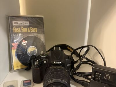 Nikon D5000 DSLR Camera with 18-55mm Lens, Charger, and Memory Cards