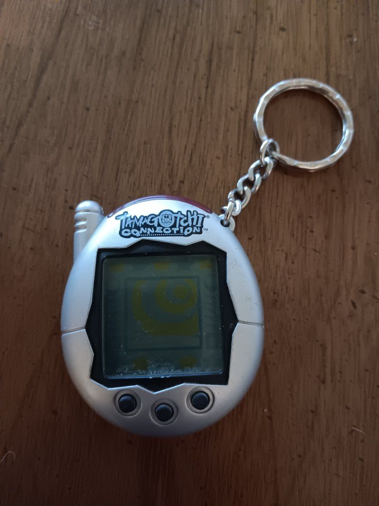 Tamagotchi Connection V3 – Metallic Silver with Black Buttons