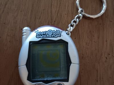 Tamagotchi Connection V3 – Metallic Silver with Black Buttons