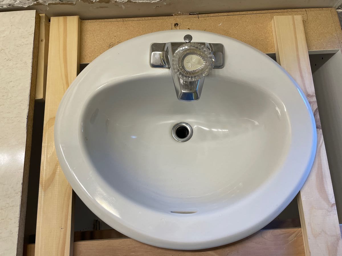 White Porcelain Oval Bathroom Sink with Chrome Faucet