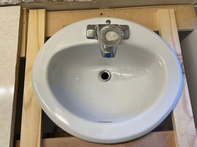 White Porcelain Oval Bathroom Sink with Chrome Faucet
