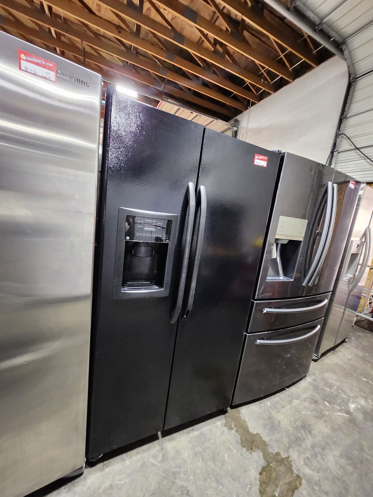 NICE GE SIDE BY SIDE FRIDGE! WITH A FULL WARRANTY