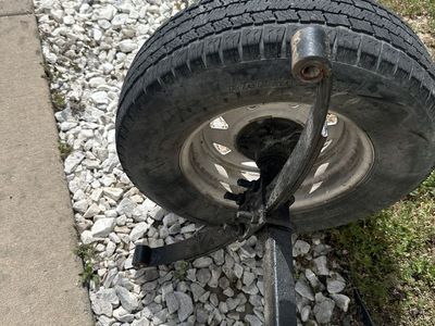 Trailer axel with springs and wheels