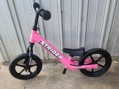 strider balance bike, pink, new condition