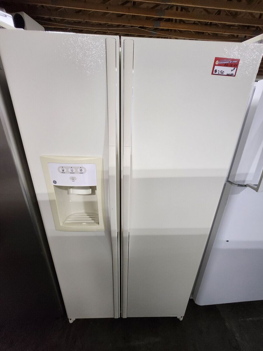 NICE GE SIDE BY SIDE FRIDGE! WITH A FULL WARRANTY