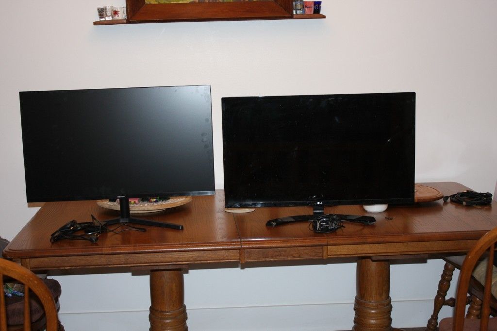 Two 32 inch computer monitors