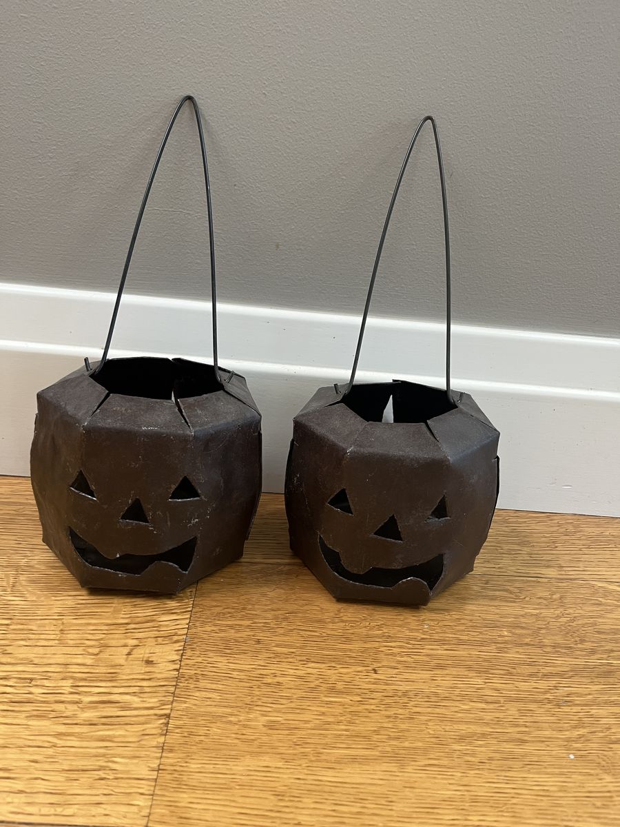 2 wrought iron, Halloween jack-o-lantern  votive candle holders. Unique, handmade excellent condition. 4.75” tall