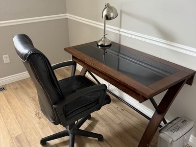 Office desk, chair, and lamp