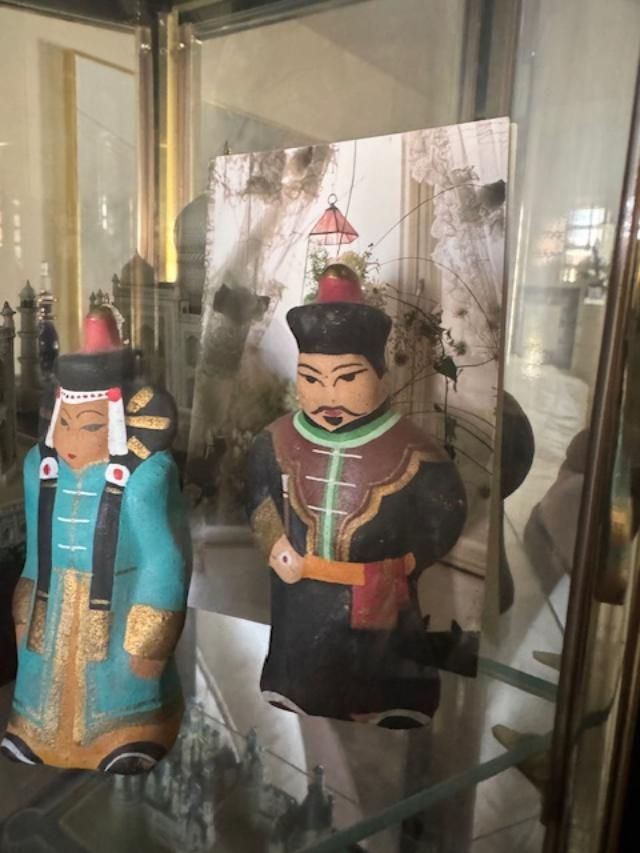 vintage Mongolian or Chinese clay figurines, often depicting an Emperor and Empress in traditional regalia