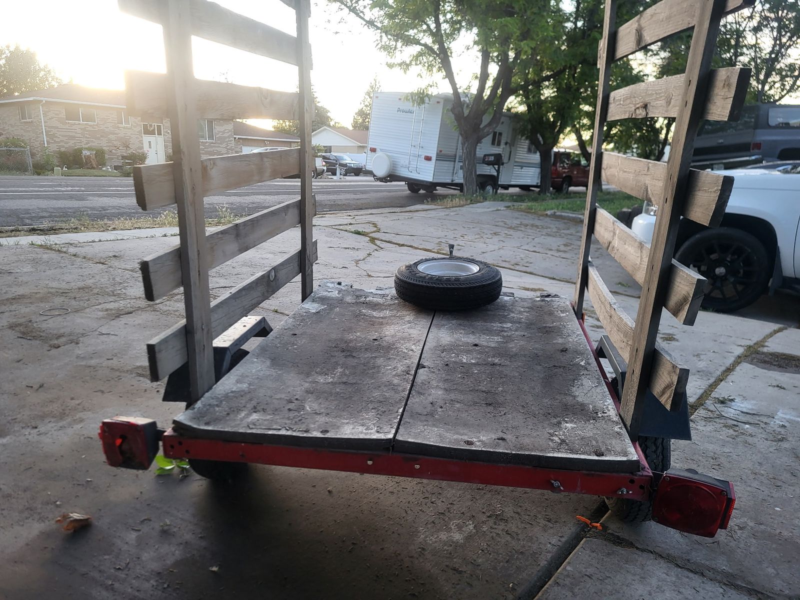 Utility Trailer with Wooden Side Racks and Red Metal Frame