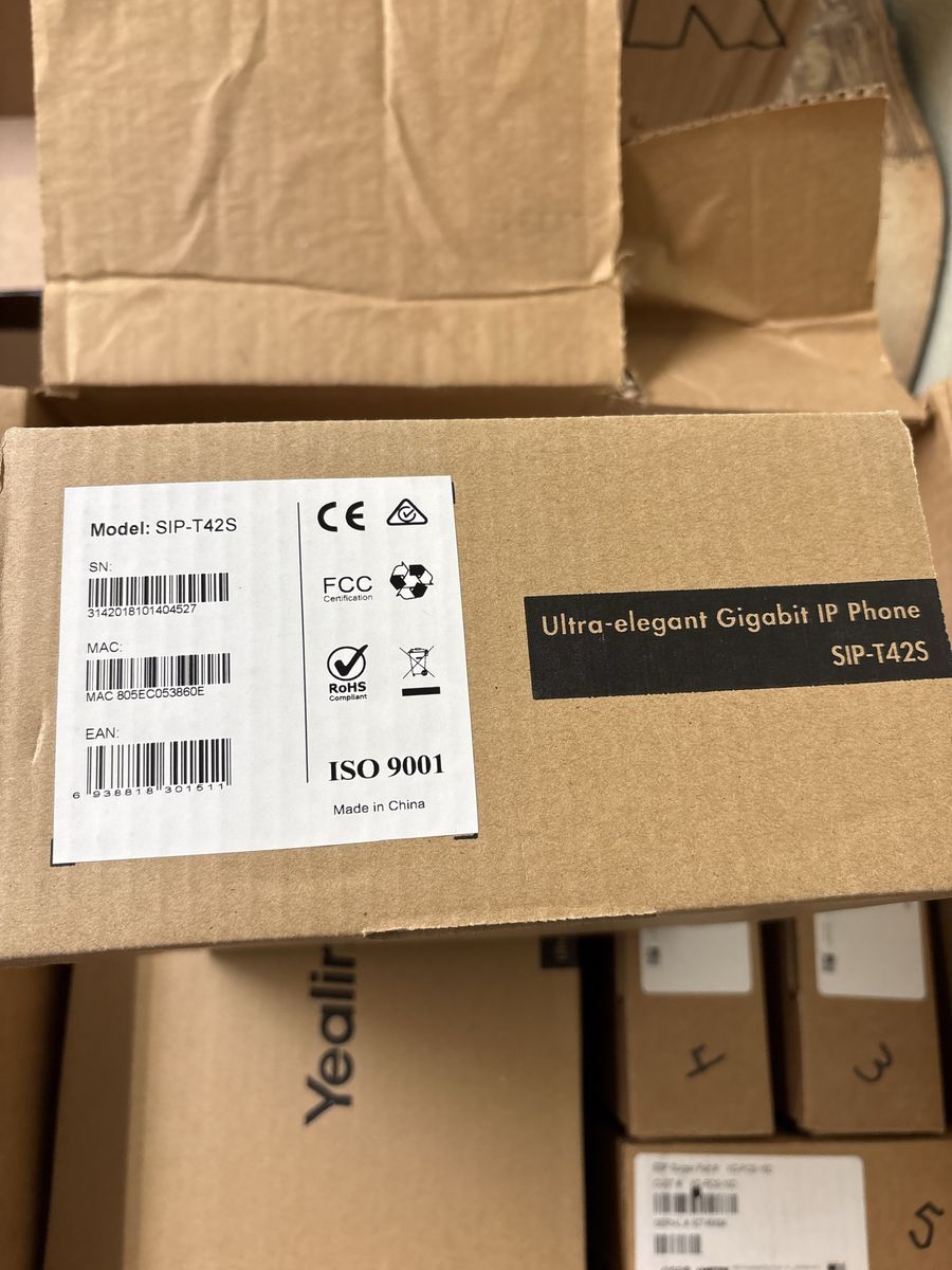5 New Yealink SIP-T42S Gigabit IP Phones + 5 SurgeX XG-PCS-15D Surge Protectors – New in Box