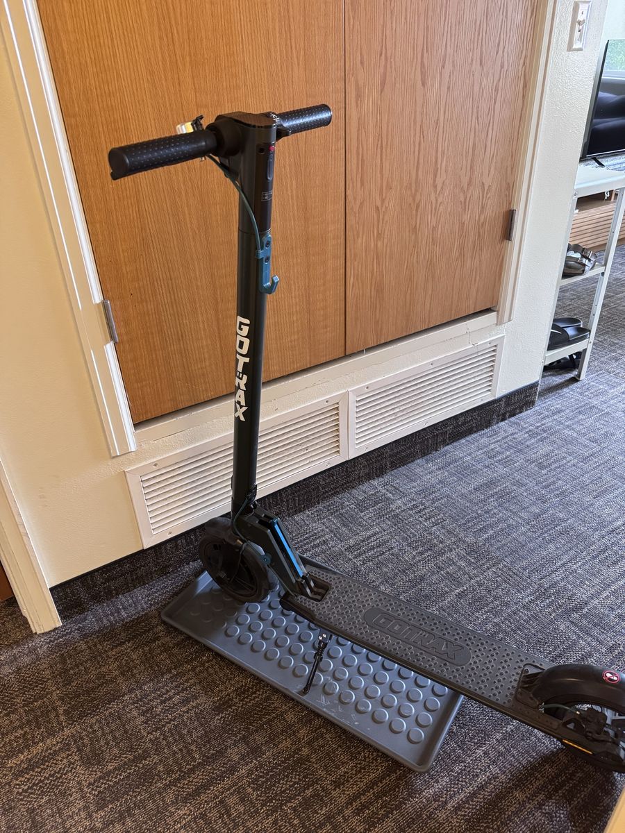 GOTRAX Rival Electric Scooter - Black with Digital Display and Headlight, Charger, and Plastic Parking Mud Pad