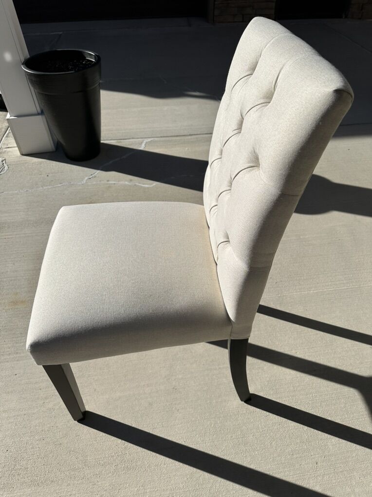 Single Dining Chair light Creme Used For Staging