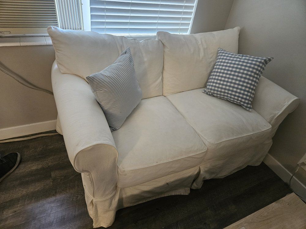 White Loveseat with Two Throw Pillows - Used Condition