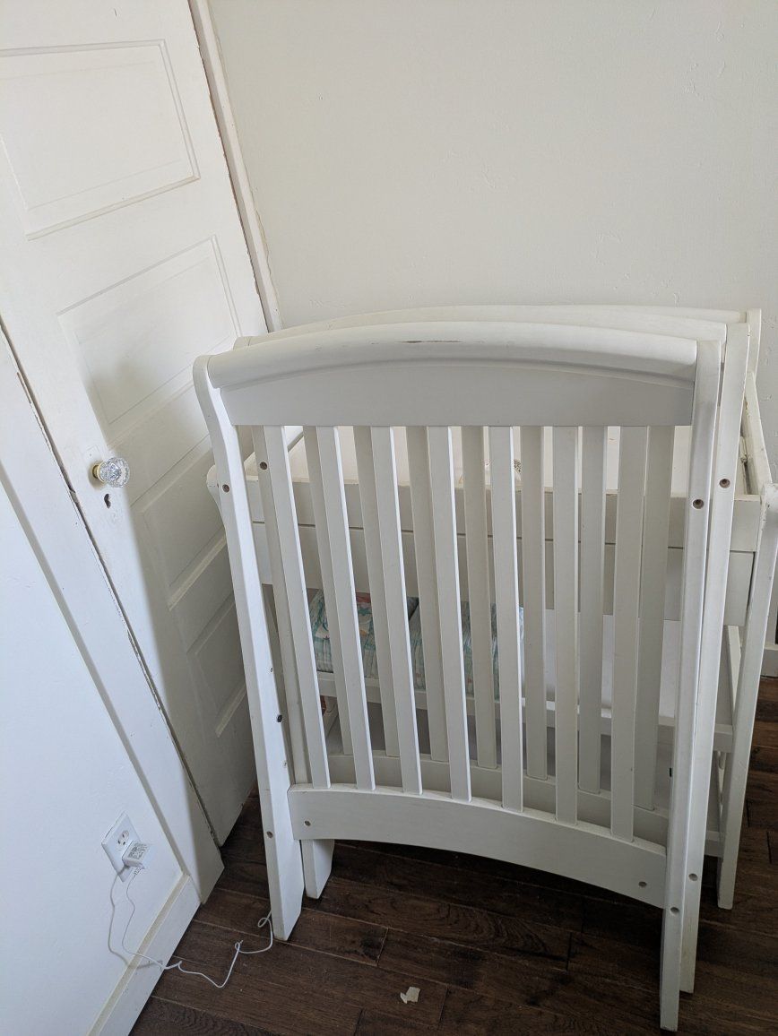 White Wooden Crib and Changing Table