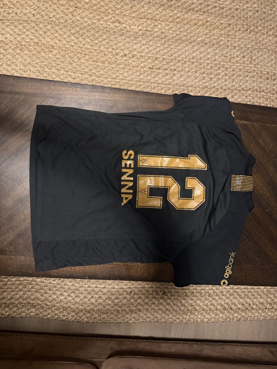 PUMA F1 Brazil Relaxed Jersey: Features a crew neck, short sleeves, and official F1