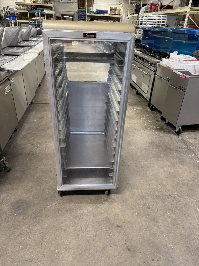 Used display Rack For full and half size bakery sheet pans in great condition portable