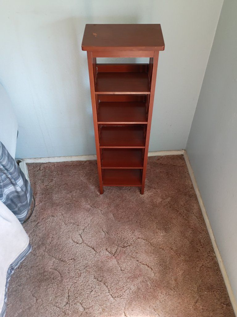 Tall Wooden Storage Tower with Multiple Shelves