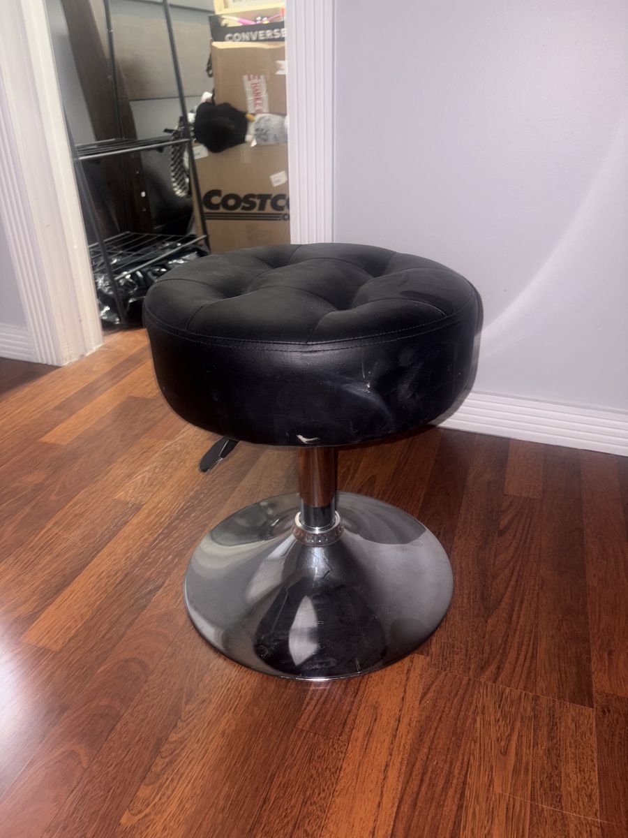 black swivel vanity stool.