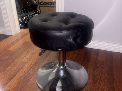 black swivel vanity stool.