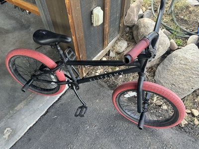 Elite BMX Bicycle Black with Red Tires and Pegs