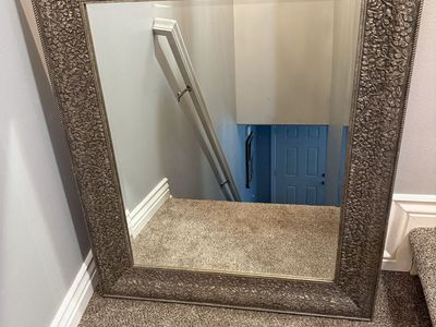 Large Decorative Wall Mirror with Intricate Antiqued Bronze Leaf Pattern Frame