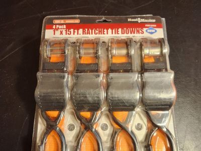 Five ratcheting tie down straps. 400 pound strength. All brand new.