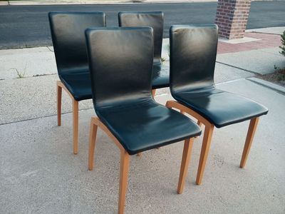 Set of four vintage leather and beech 'Libra' dining chairs