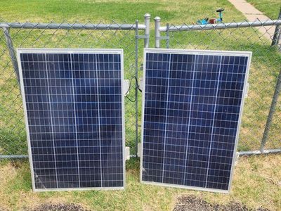 Pair of Used Coleman 100w Solar Panels - Good Condition for Off-Grid or Supplemental Power