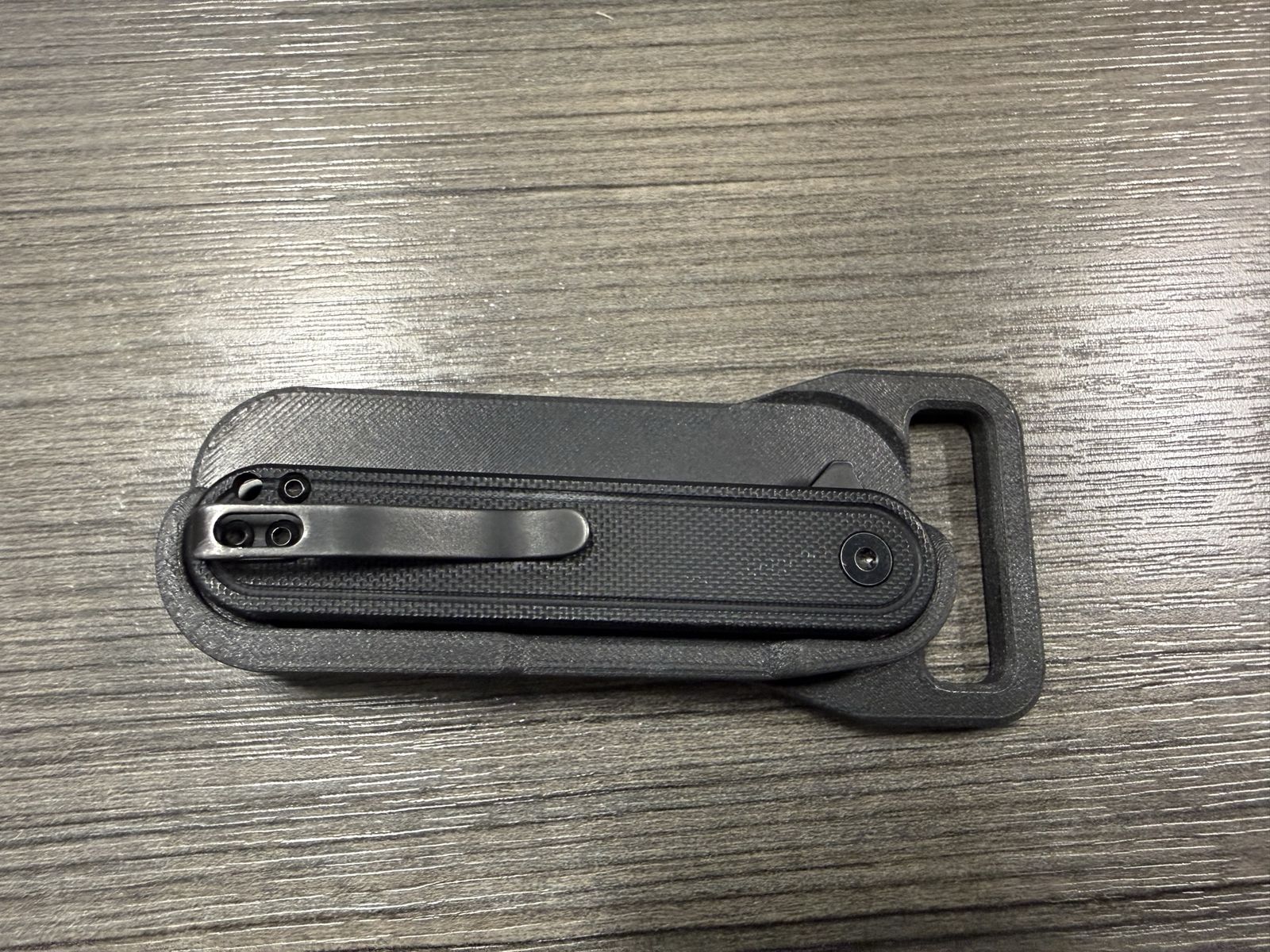 Knife holder with belt buckle