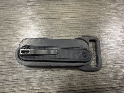 Knife holder with belt buckle