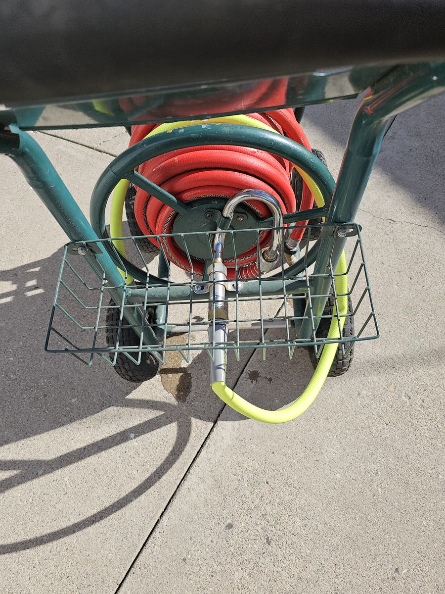 One hundred foot commercial three quarter inch water hose and heavy duty reel assembly