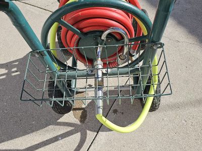 One hundred foot commercial three quarter inch water hose and heavy duty reel assembly