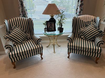 Two Green and White Striped Wing Back Chairs