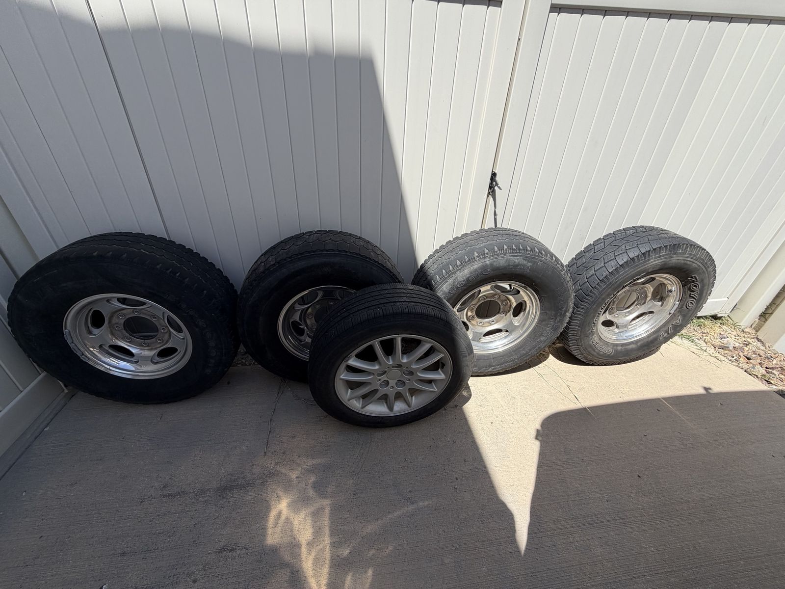 Three-quarter ton Ford tires and rims and extras