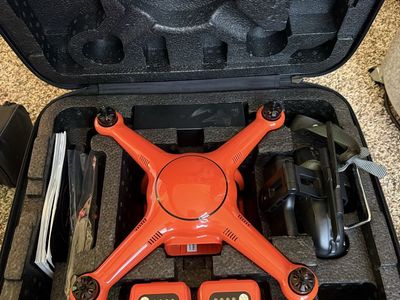 Orange Autel Drone with Controller, Extra Batteries, Chargers and Hard Case