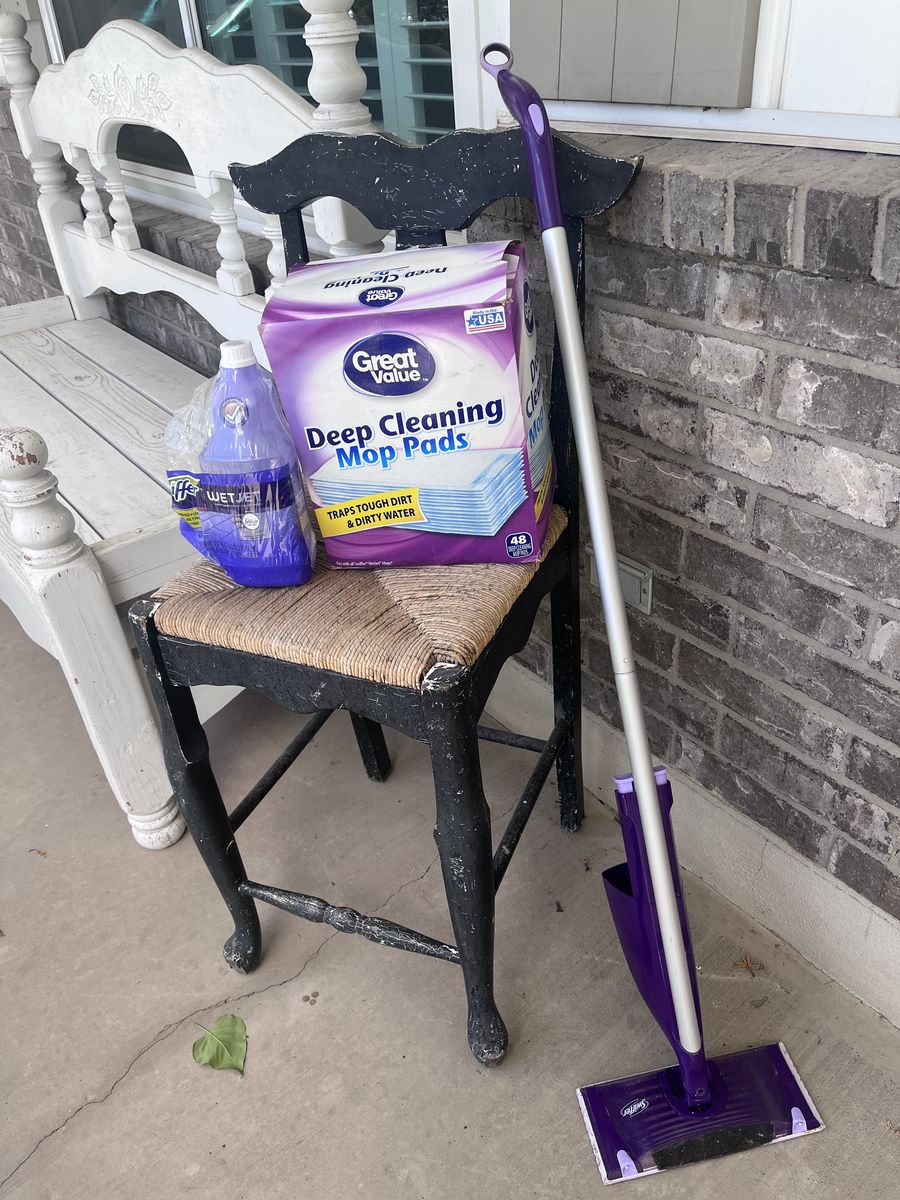 Swiffer Wet Mop plus 1 Bottle of Solution and a mostly full box of Pads